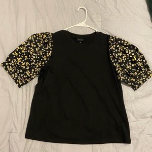 Black blouse with yellow floral puffy sleeve